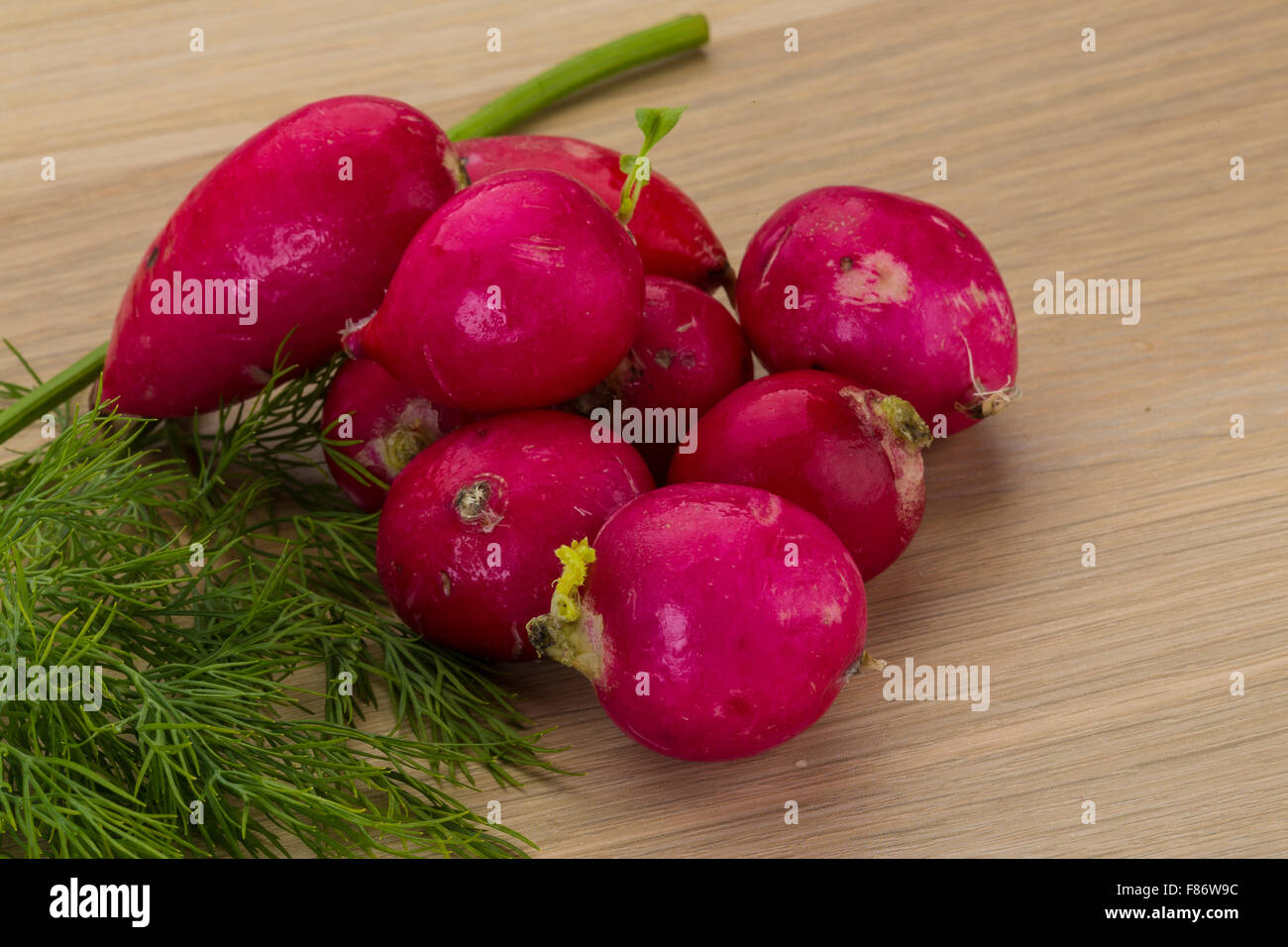Radish with dill on the desk Stock Photo - Alamy