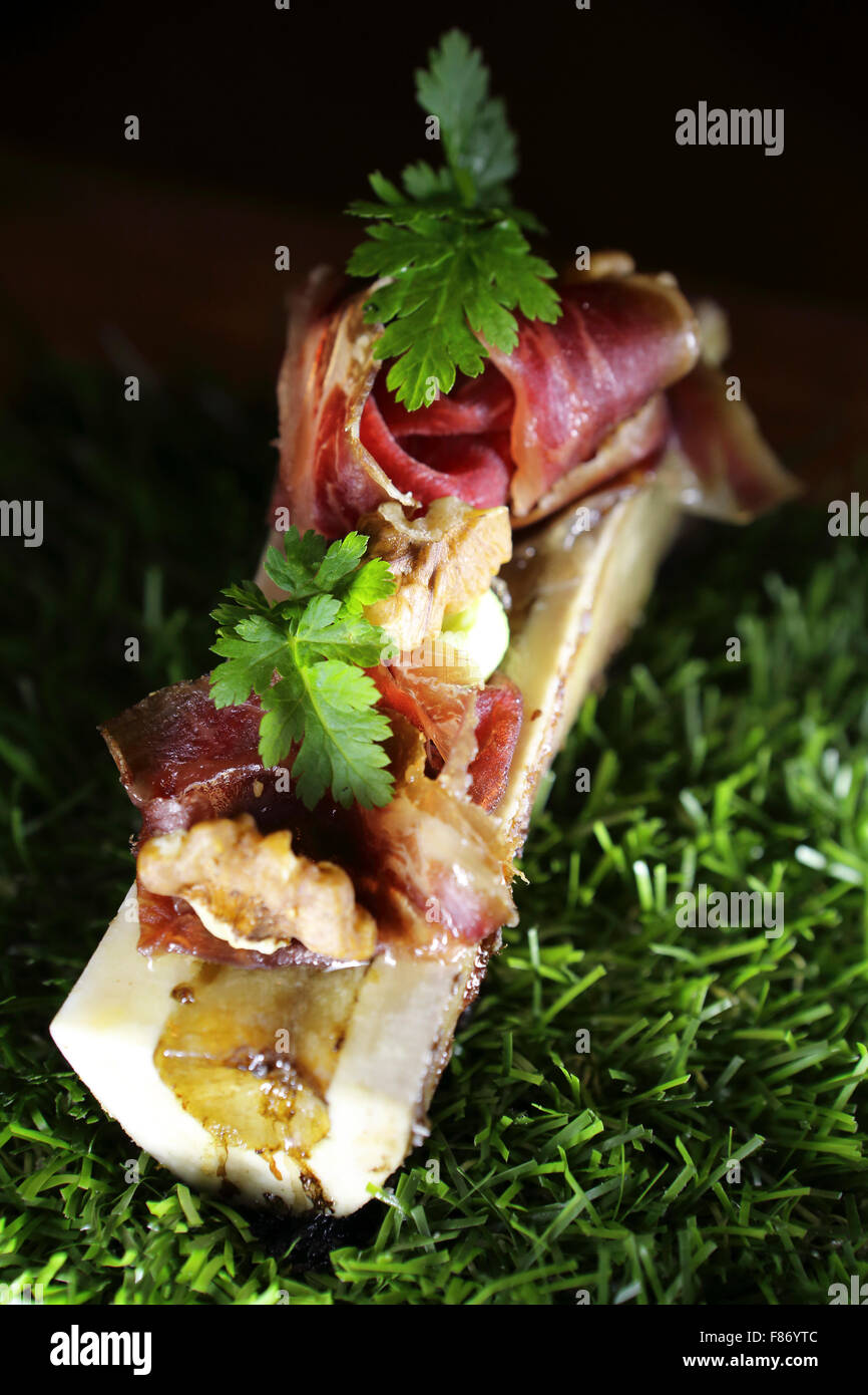 Bone marrow with Bellota and Pata Negra ham served at the Naturell restaurant in central Ghent, Belgium. Stock Photo