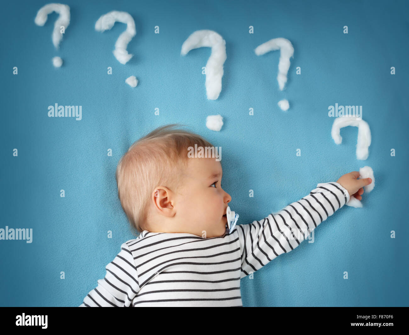 little boy with lots of question marks Stock Photo