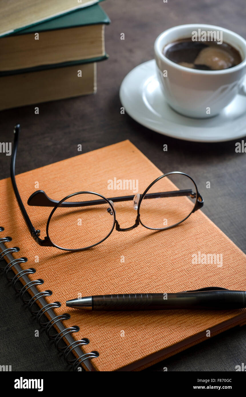 Stack of books and a pair of glasses . Close up Stock Photo