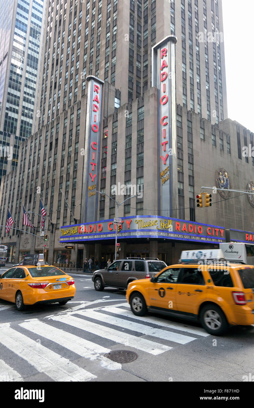 new york city, 12 september 2015: yellow cabs in front of radio city music hall in manhattan Stock Photo