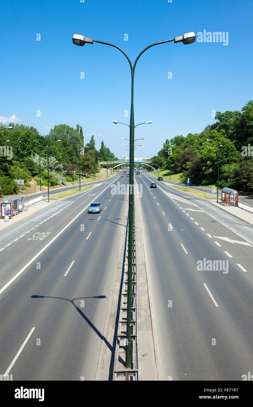 4 lane city road with a bus lane (Aleja Armii Ludowej, Warsaw, Poland) Stock Photo