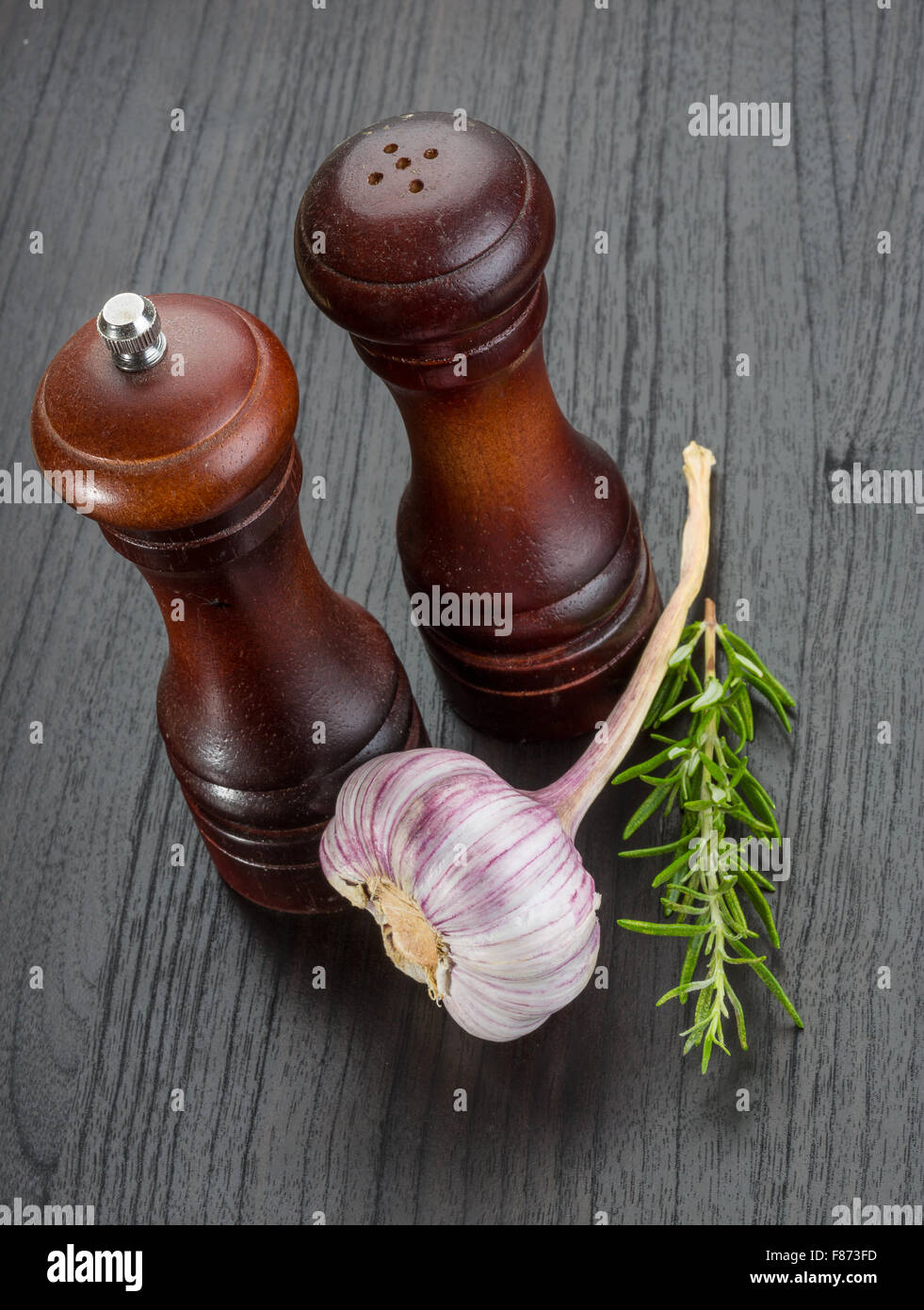 Pepper mill with garlic and rosemary Stock Photo Alamy