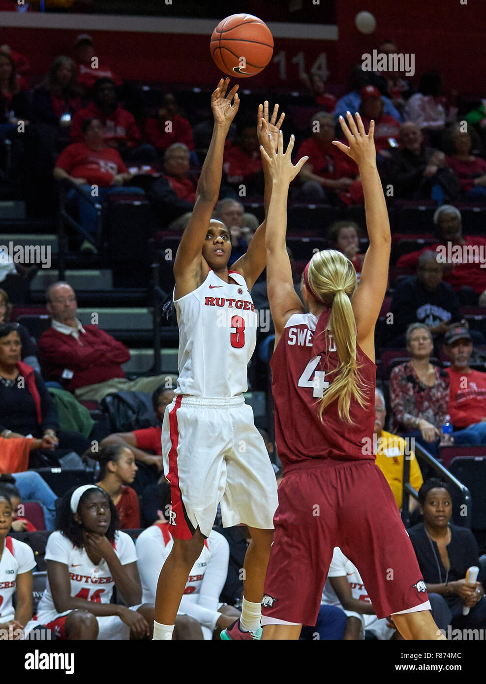 Piscataway, New Jersey, USA. 6th Dec, 2015. Rutgers guard Tyler Scaife (3) shoots over Arkansas guard/forward Keiryn Swenson (4) finished with 24 points during NCAA basketball action between the Arkansas Razorbacks and the Rutgers Scarlet Knights at Rutgers Athletic Center in Piscataway, New Jersey. Rutgers defeated Arkansas 60-40. Duncan Williams/CSM/Alamy Live News Stock Photo