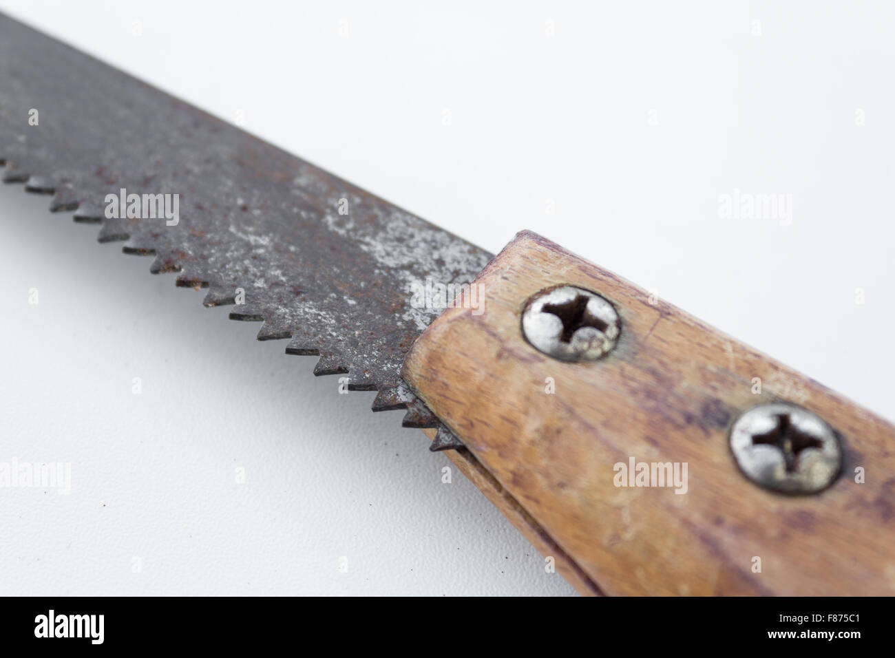 saw / old handsaw isolated - vintage saw / tool closeup Stock Photo