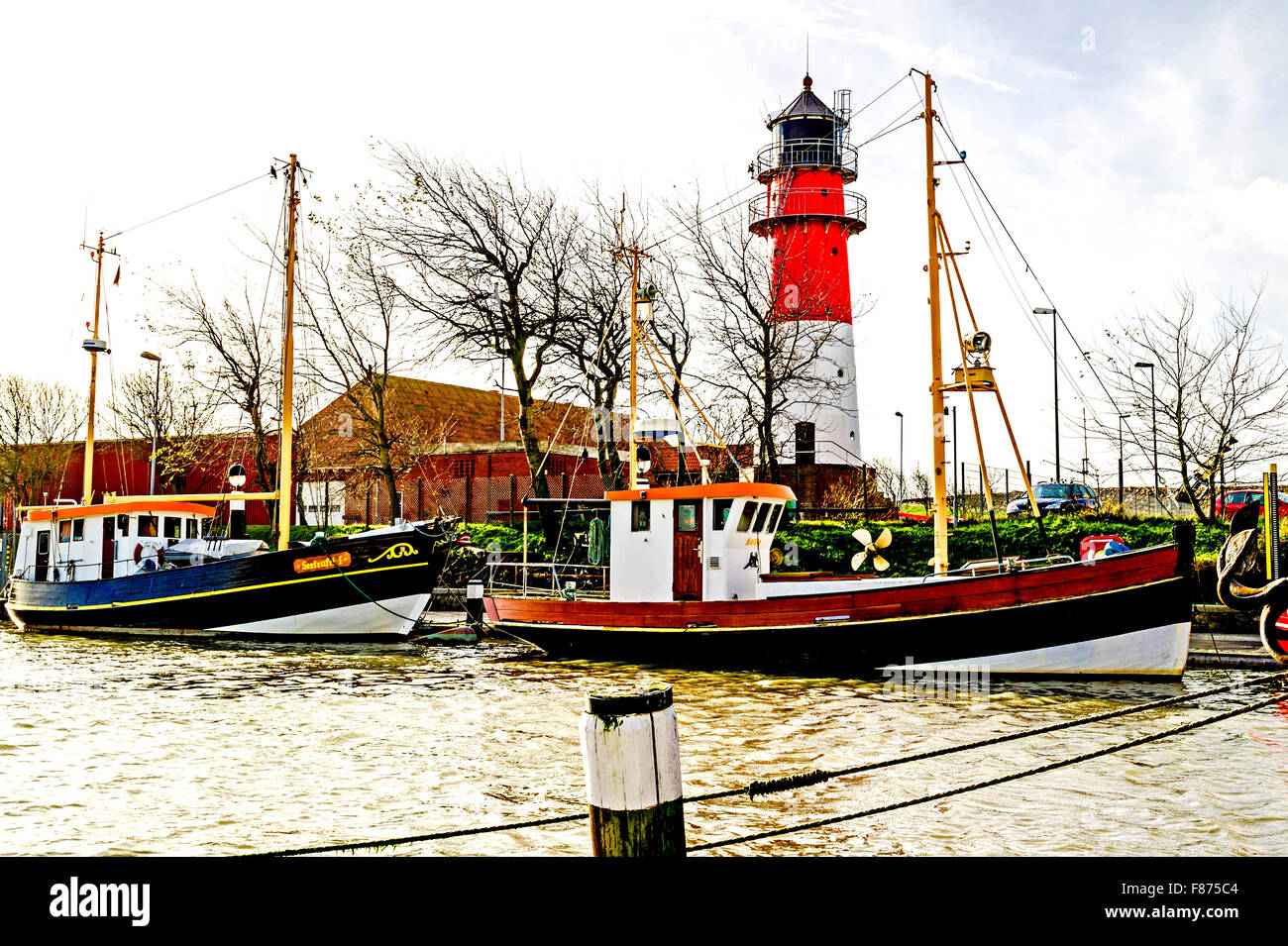 Buesum harbour with lighthouse; Hafen von Büsum mit Leuchtturm Stock Photo