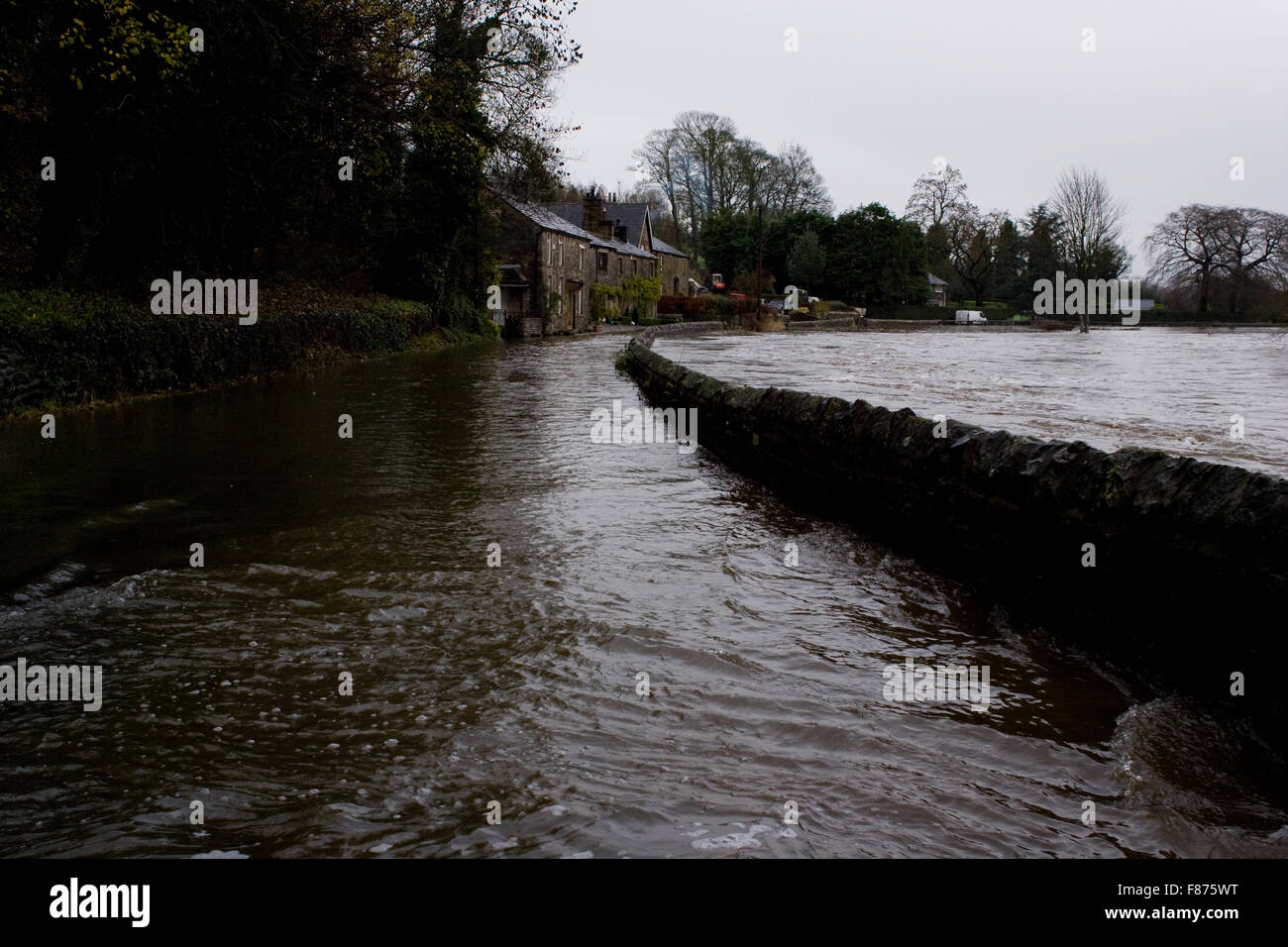 A flooded lane in Lancashire after the River Ribble broke it's banks as a result of heavy rainfall caused by Storm Desmond. Stock Photo
