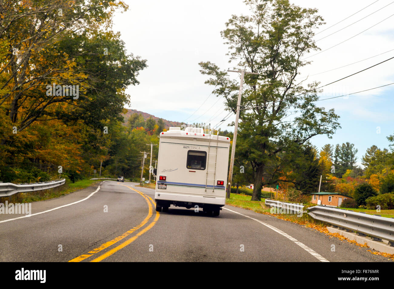An RV on the road in autumn, Massachusetts, United States Stock Photo