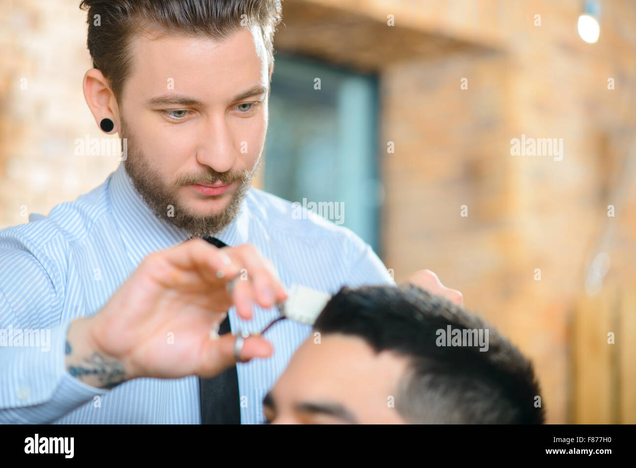 Professional barber making haircut Stock Photo Alamy