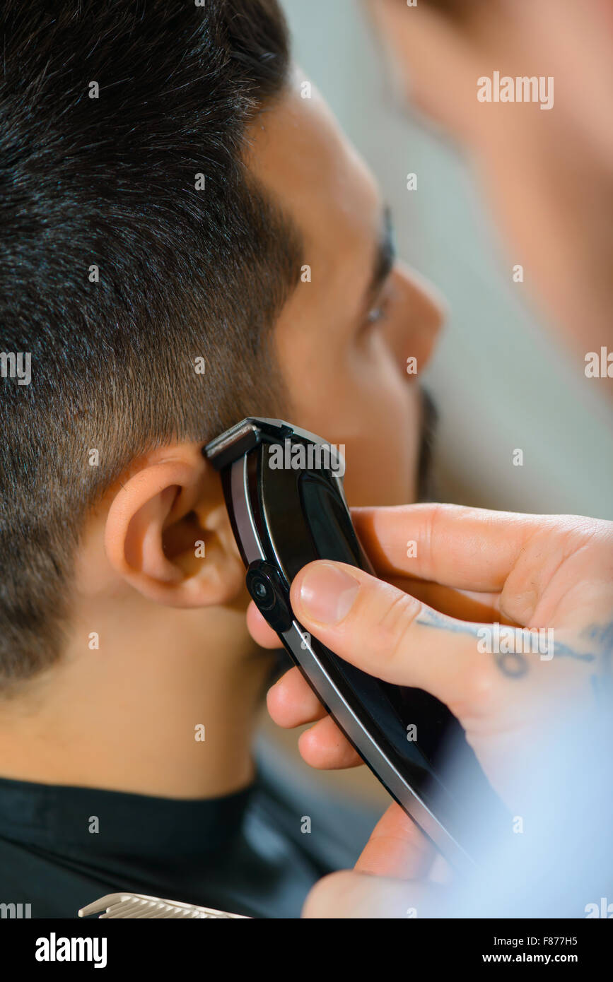 Professional barber holding razor Stock Photo Alamy