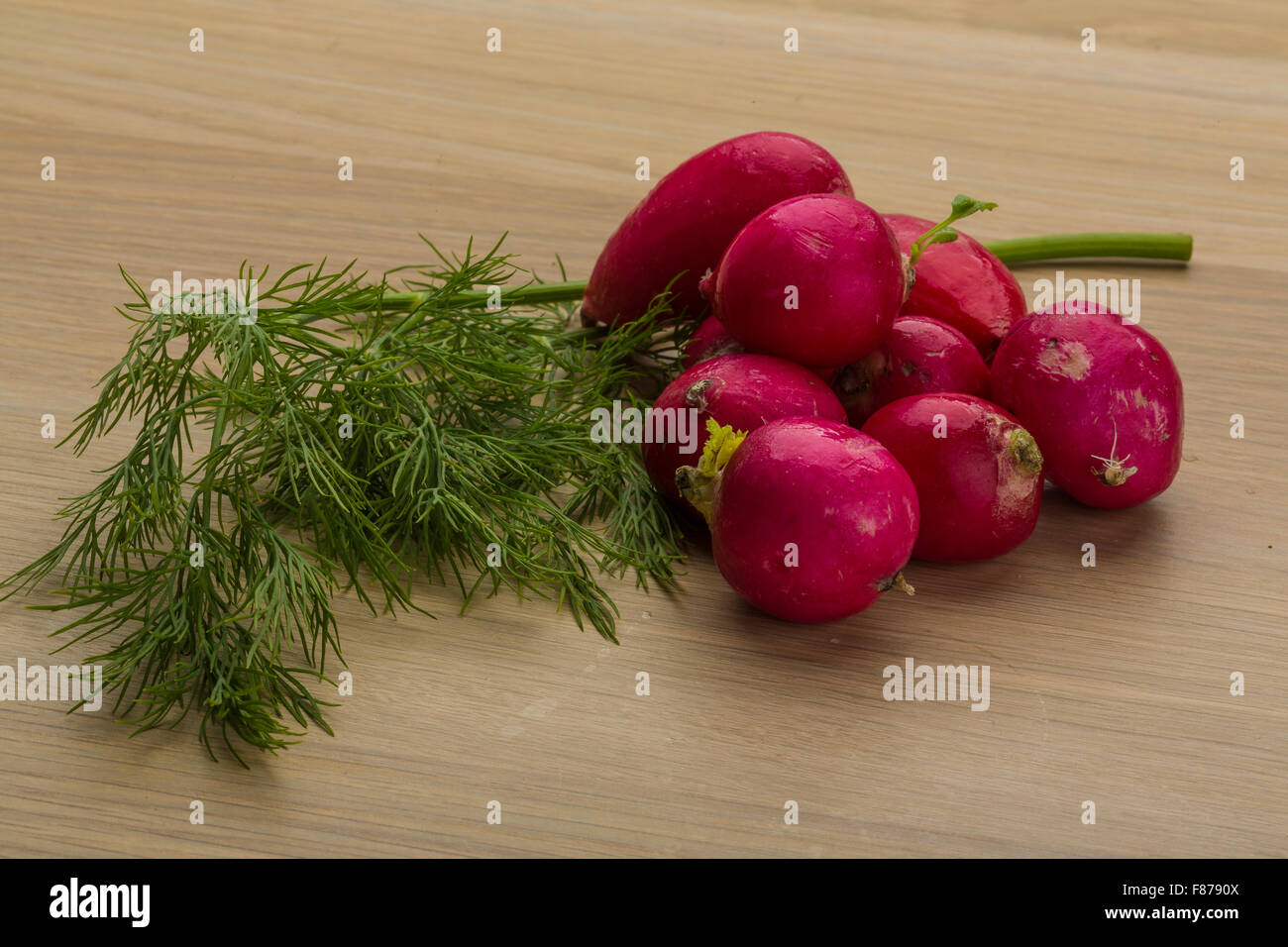 Radish with dill on the desk Stock Photo - Alamy