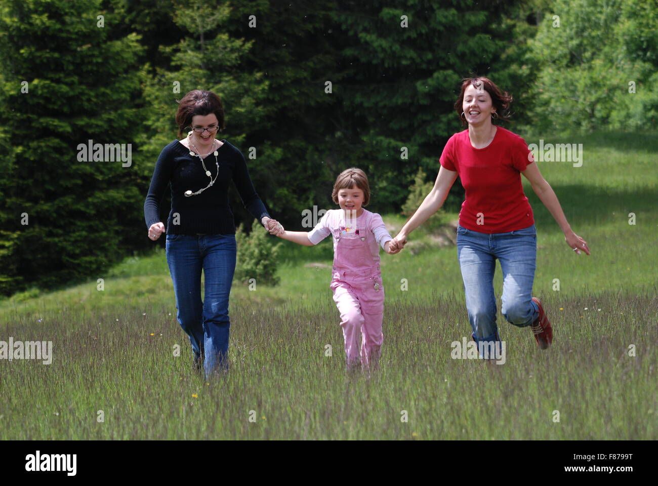 happy girls running in nature Stock Photo - Alamy