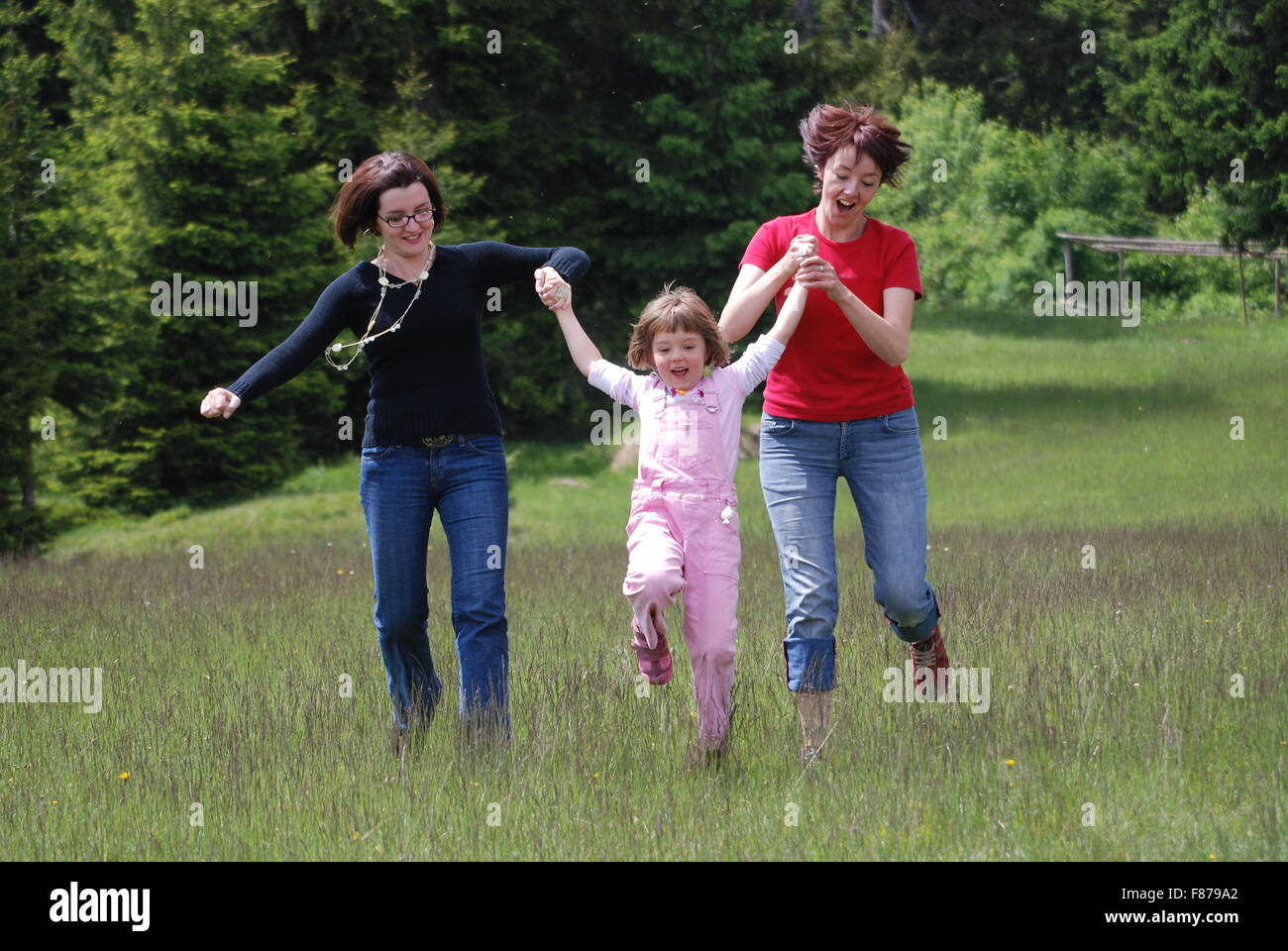 happy girls running in nature Stock Photo - Alamy