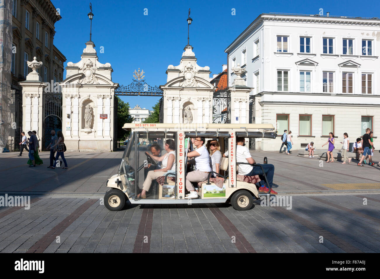 A sightseeing tour cart in from of the the Warsaw University gate in Warsaw, Poland Stock Photo