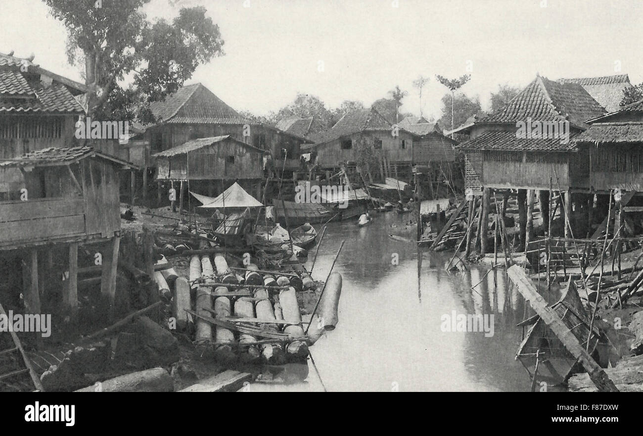 A Malay Village - The houses in a Malayan Village are always upon the water, if possible, and invariably raised on piles above the ground from six to eight feet, circa 1900 Stock Photo