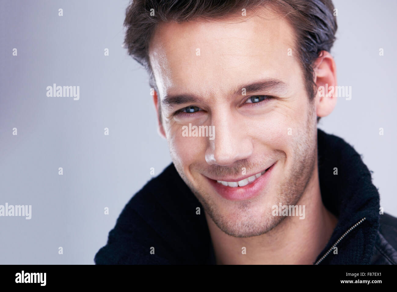 handsome young man portrait isolated on white background in studio ...