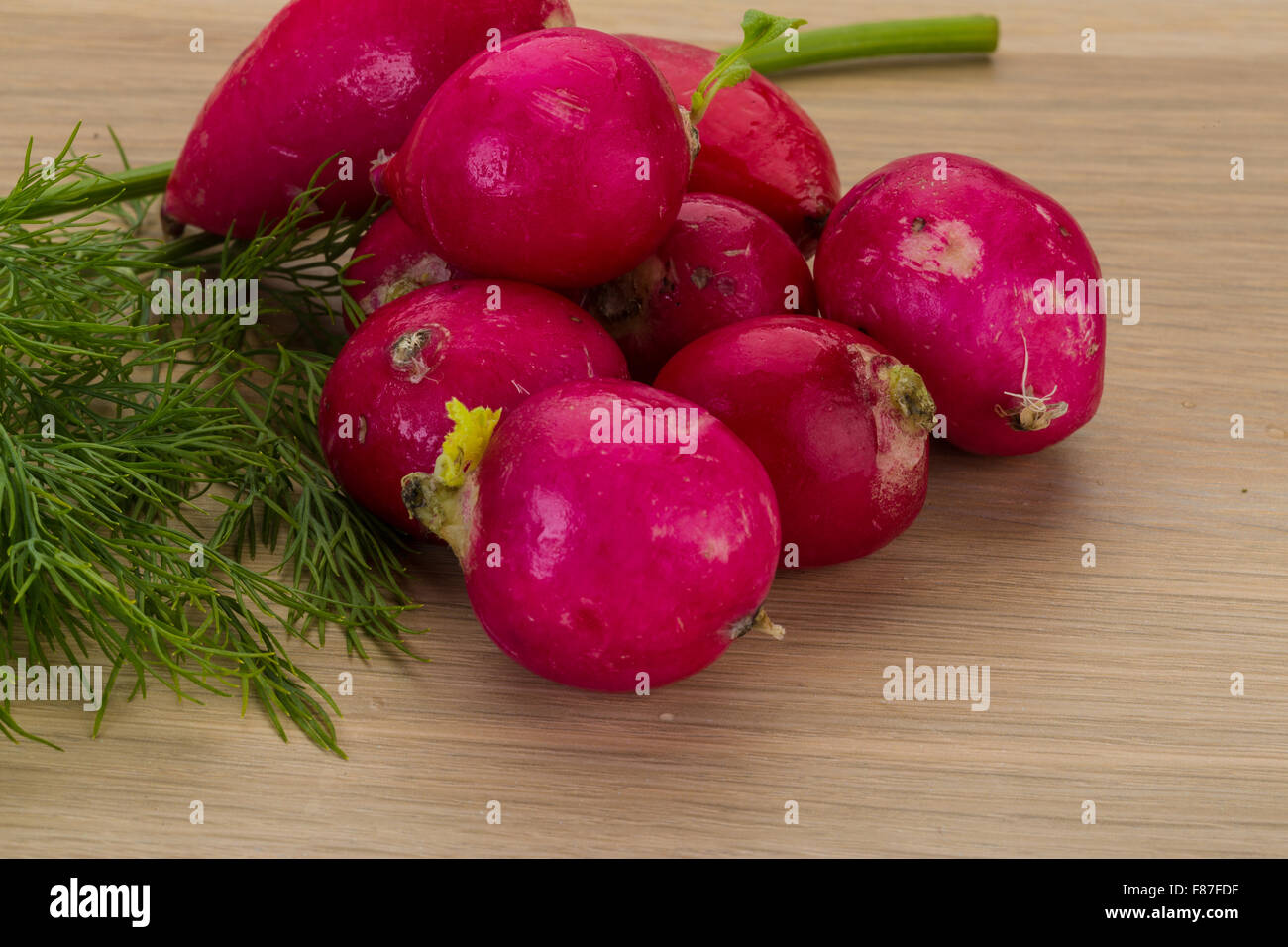Radish with dill on the desk Stock Photo - Alamy