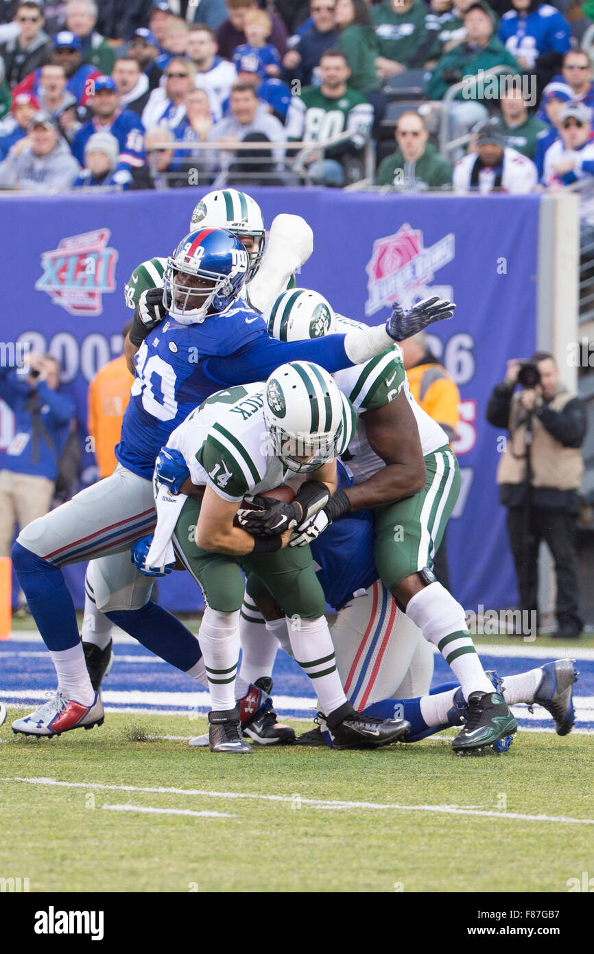 East Rutherford, New Jersey, USA. 6th Dec, 2015. New York Giants defensive end Jason Pierre-Paul (90) reaches for New York Jets quarterback Ryan Fitzpatrick (14), who is dealing with defensive end Robert Ayers (91), during the NFL game between the New York Jets and the New York Giants at MetLife Stadium in East Rutherford, New Jersey. The New York Jets won 23-20. Christopher Szagola/CSM/Alamy Live News Stock Photo