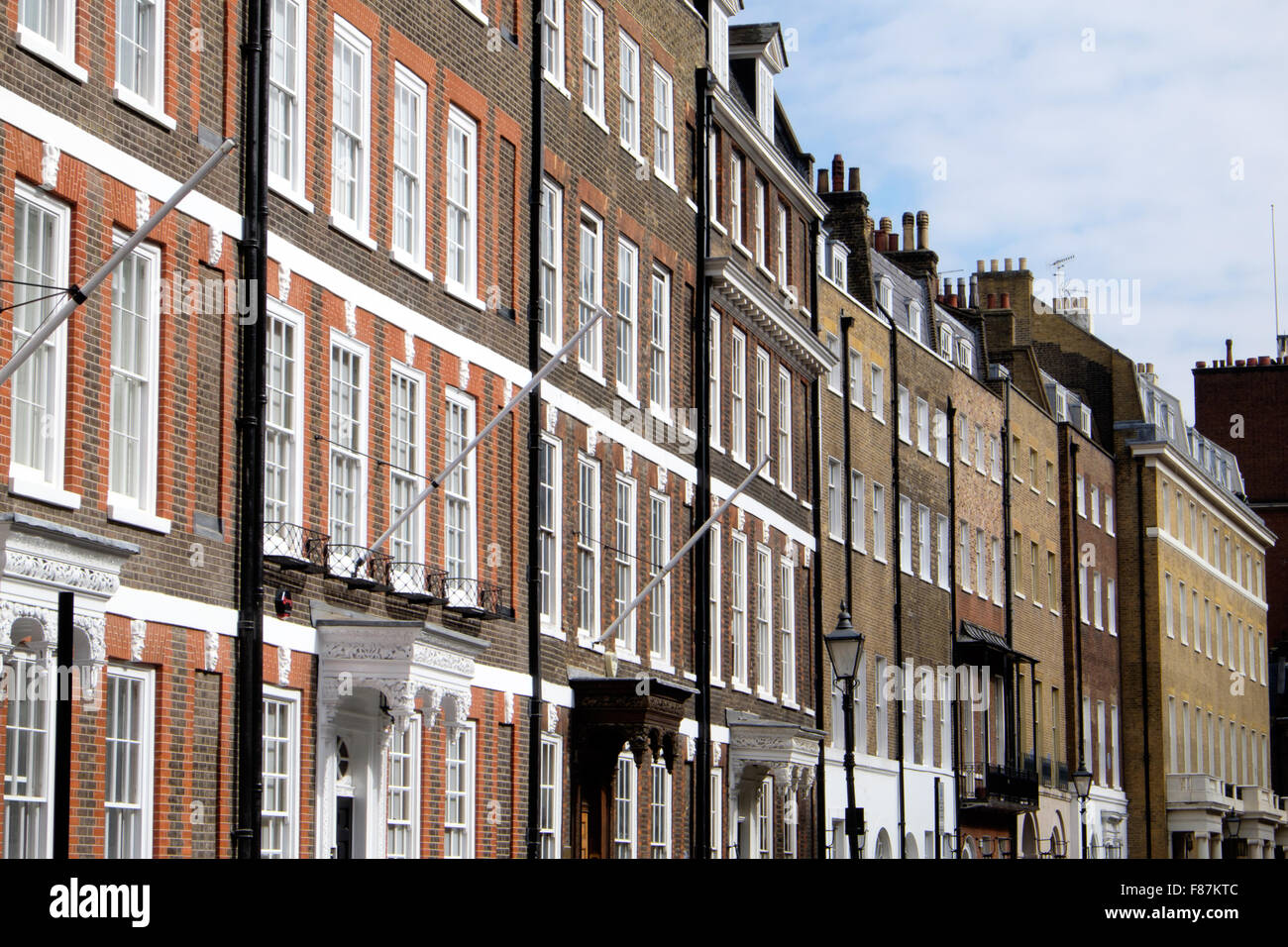 Typical London rowhouses line a street in Central London Stock Photo