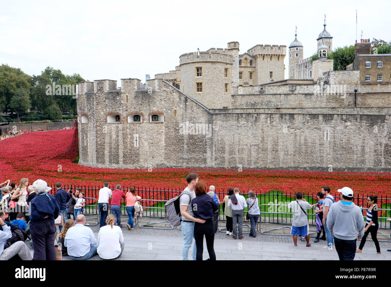 Dotted with artistic red poppies, the Tower of London is being prepared for Rememberance Day, in honor of lives lost in WWI. Stock Photo
