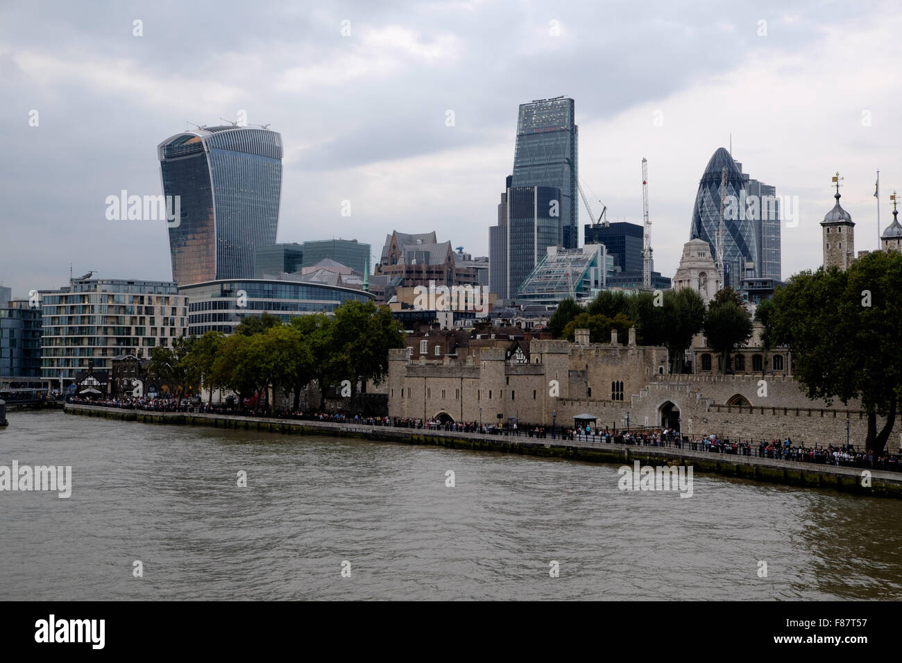 The modern London skyline rises high above the ancient Tower of London Stock Photo