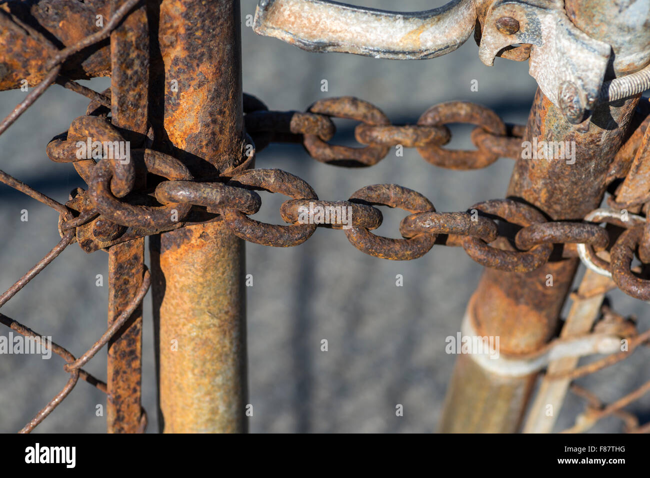 fence post, chain links, metal, chain, rusty, rusted, close up Stock