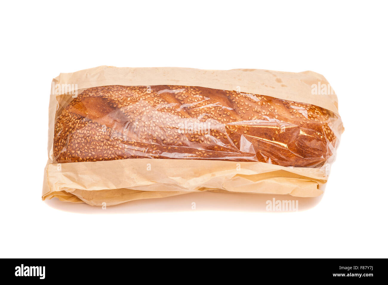White bread with sesame in a paper bag isolated on white background ...