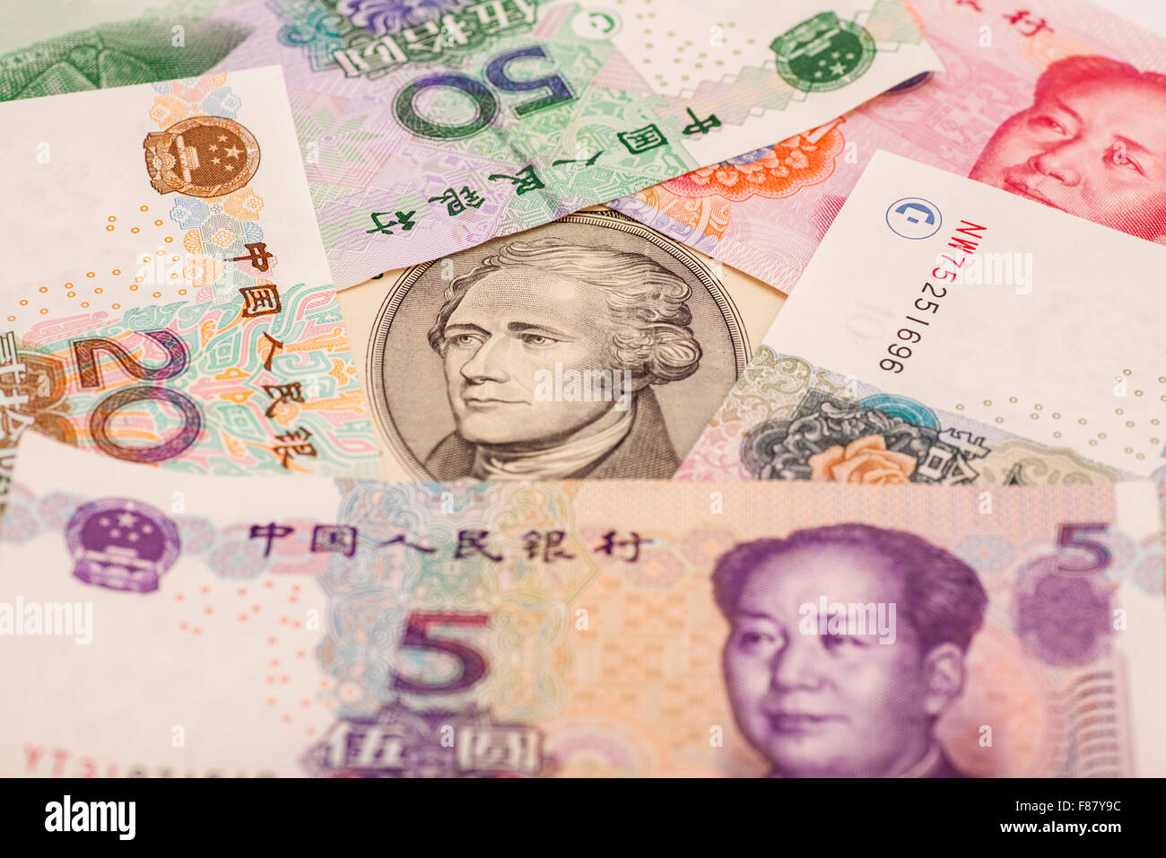 Ten dollar bill surrounded by Chinese Yuan Stock Photo - Alamy