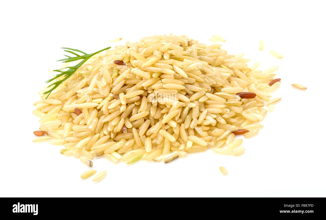 Raw rice mix heap isolated Stock Photo - Alamy