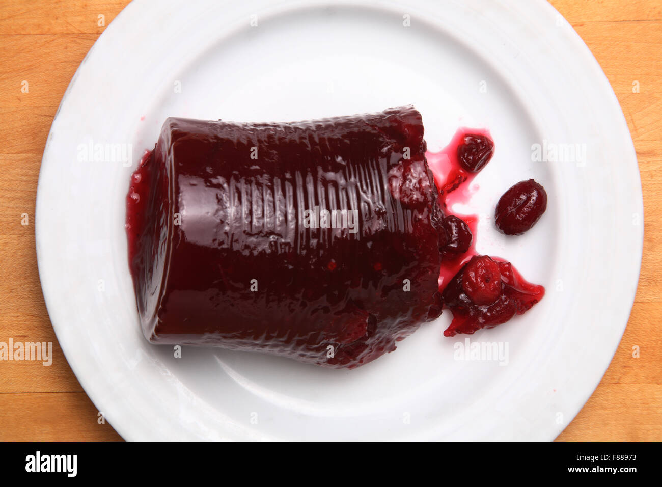 Canned cranberry sauce on white plate Stock Photo - Alamy