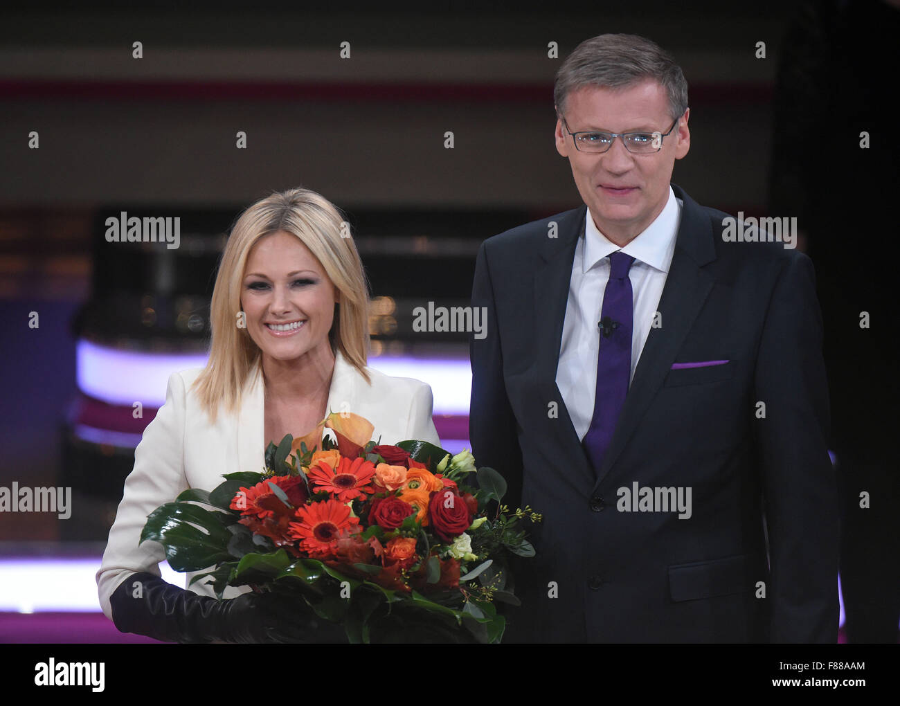 Singer Helene Fischer and host Guenther Jauch stand on stage during RTL's  end-of-year review '