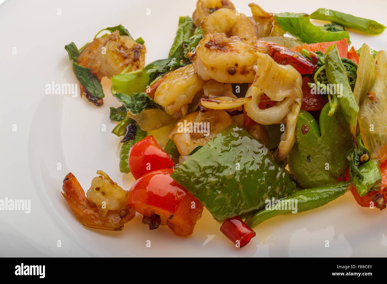 Seafood with vegetables - shrimps and calamari Stock Photo - Alamy