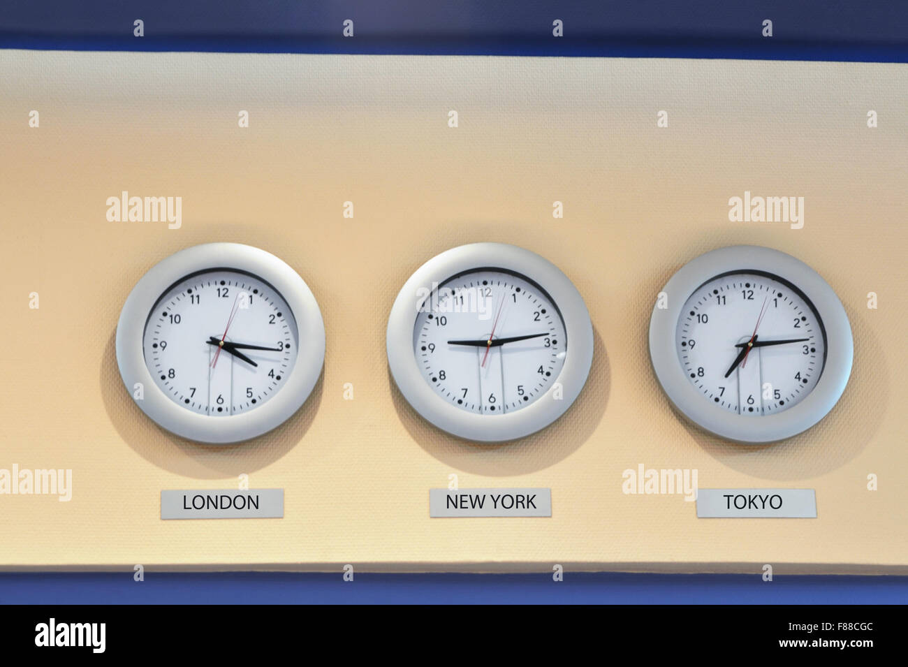 world time zones on three analog clocks Stock Photo Alamy
