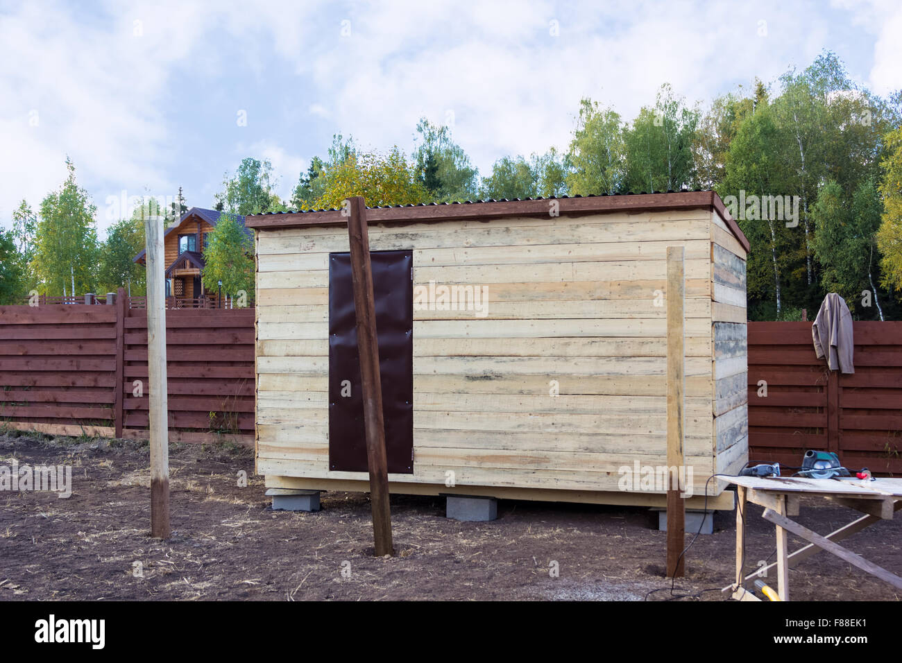 wooden poles for the canopy extension to the barn Stock Photo Alamy