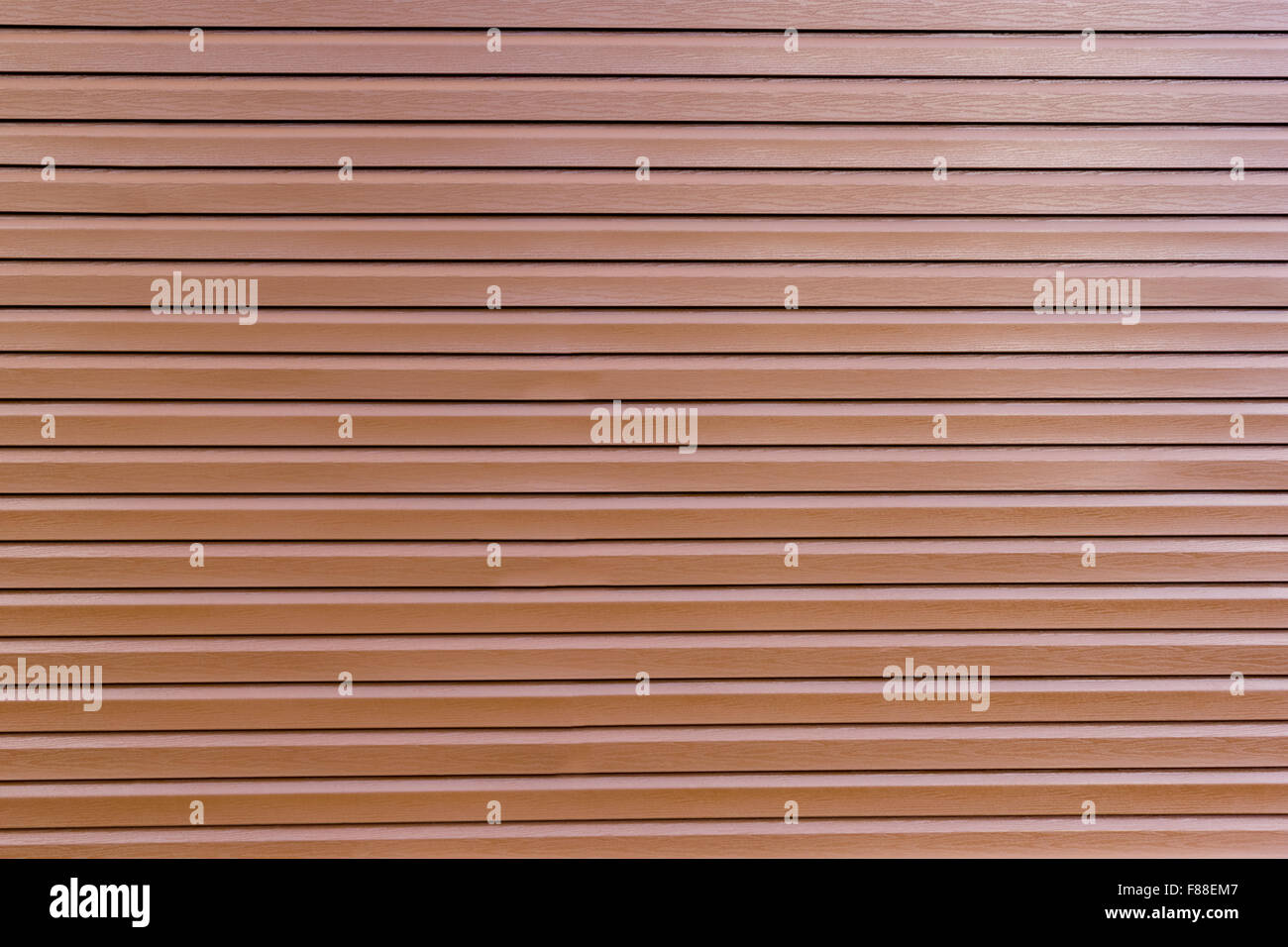 background of glossy brown vinyl siding planks Stock Photo