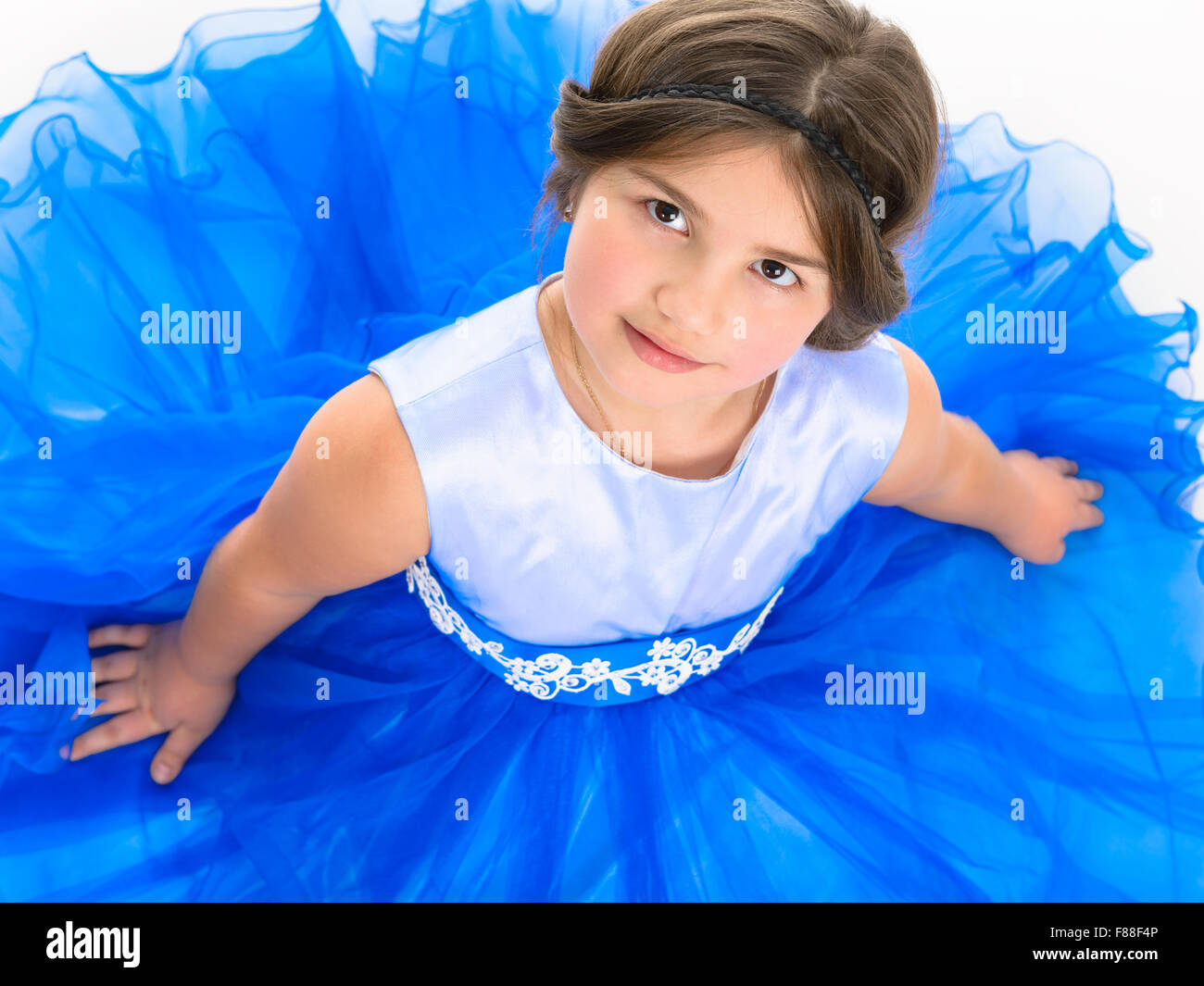 Portrait of a beautiful little girl in a blue dress Stock Photo - Alamy