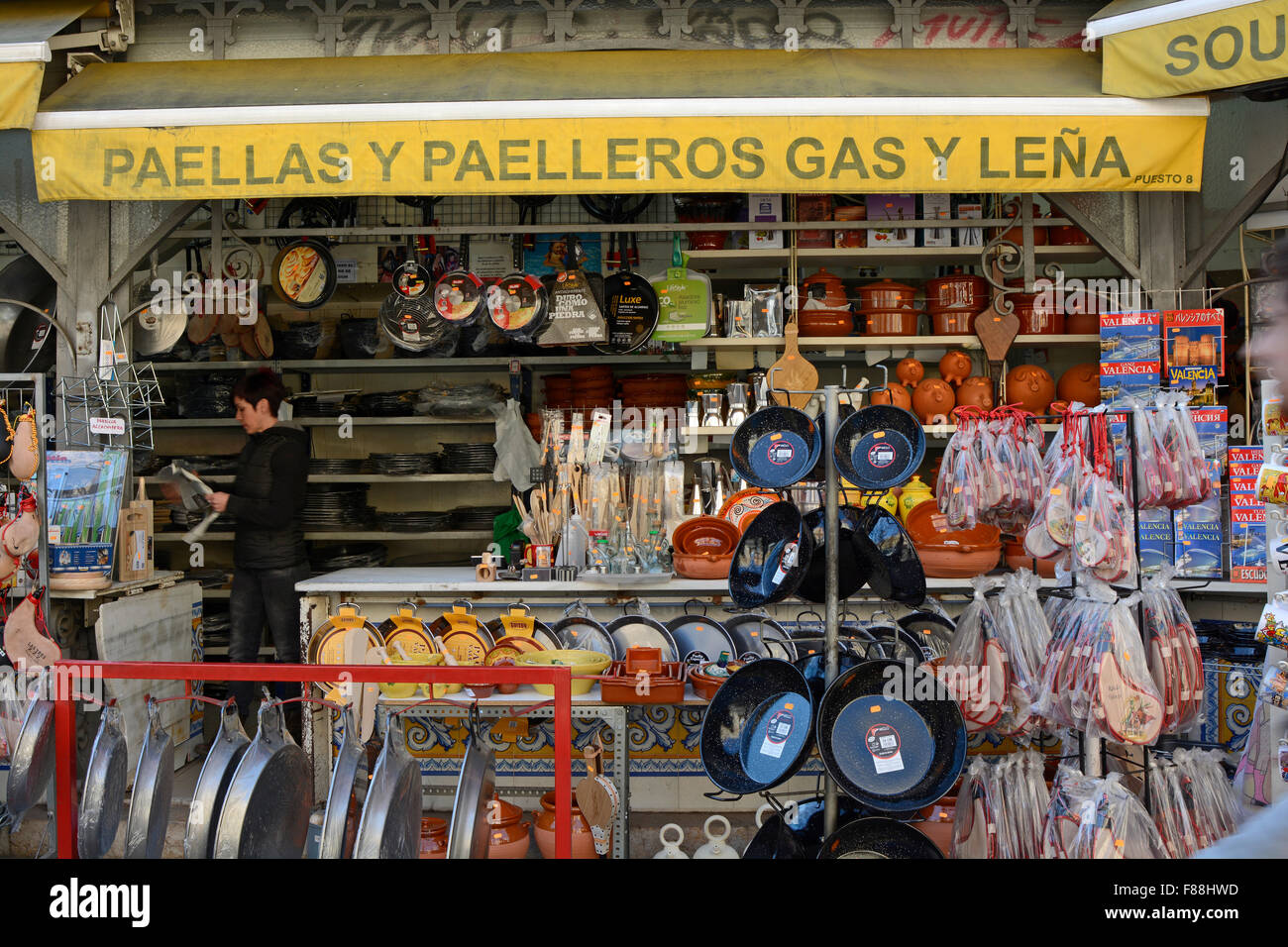 Hardware and cookware shop with outdoor display of pots and paella pans. Near Indoor Market in