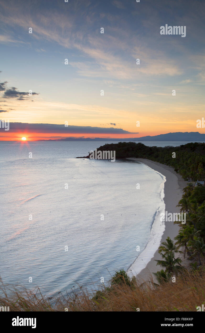 Mana Island at sunrise, Mamanuca Islands, Fiji Stock Photo