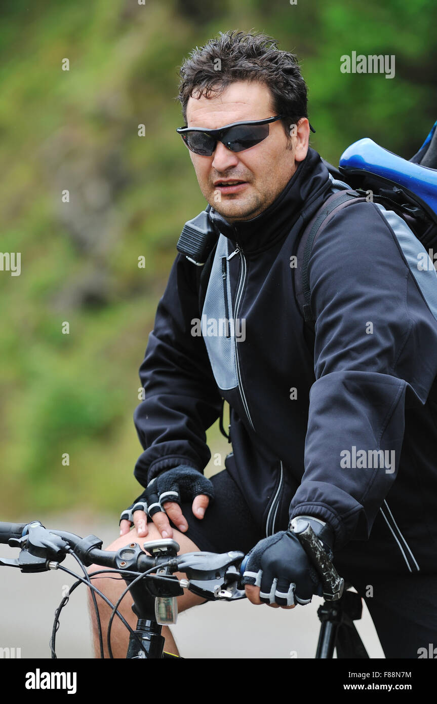 healthy lifestyle and fitness concept with mount bike man outdoor Stock