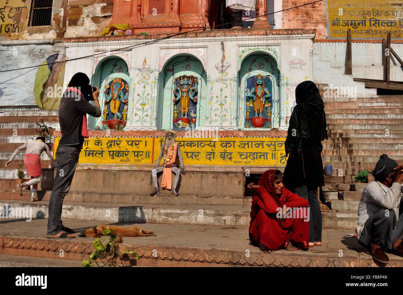 A photographer taking picture of a Naga Sadhu in Varanasi. Varanasi is the second oldest city in the world, situated at the bank Stock Photo