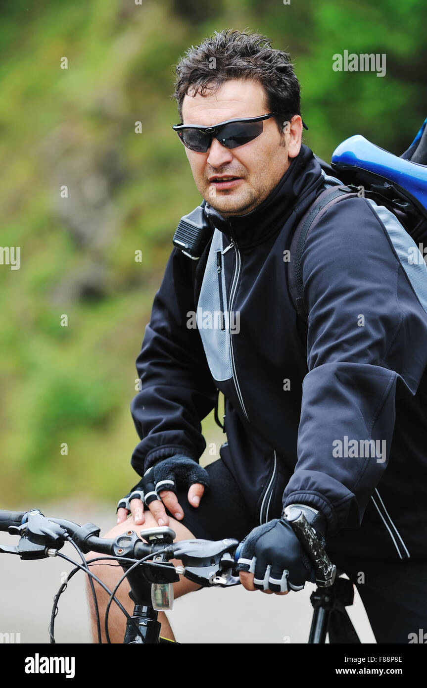 healthy lifestyle and fitness concept with mount bike man outdoor Stock