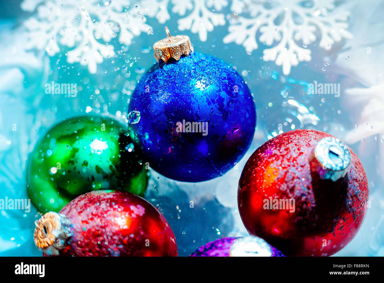 new year frozen ice balls melt ice water winter seasonal with water drops  bokeh background wallpaper Stock Photo - Alamy