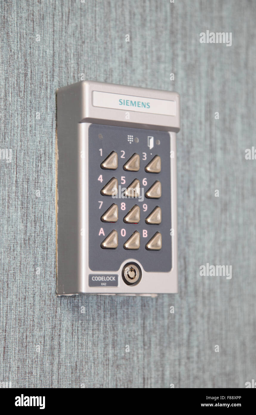 A wall-mounted electronic security key pad to operate a secure exit door in a care home in Kent, UK Stock Photo