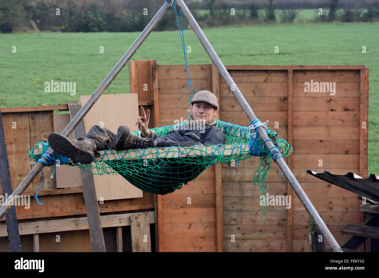 Upton, Chester, UK. 7th December 2015. Anti-fracking protester checks his tripod for comfort. Part of the direct action apparatus to hinder eviction. Credit:  Dave Ellison/Alamy Live News Stock Photo