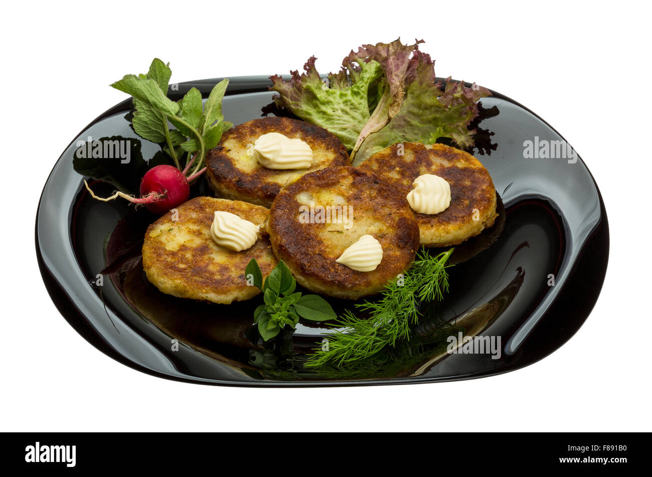 Hash browns with herbs on the plate Stock Photo Alamy