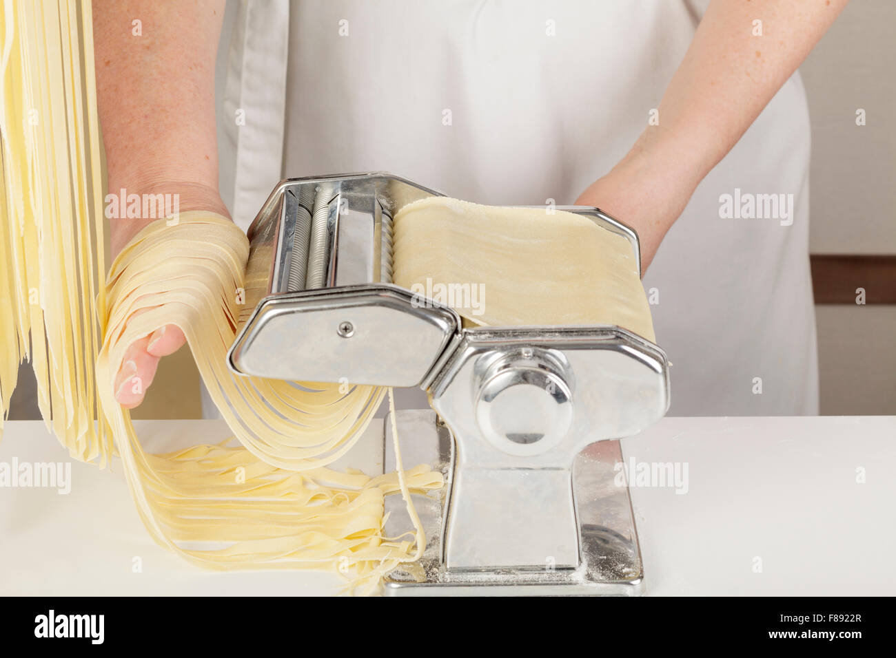 chef making fresh tagliatelle pasta Stock Photo