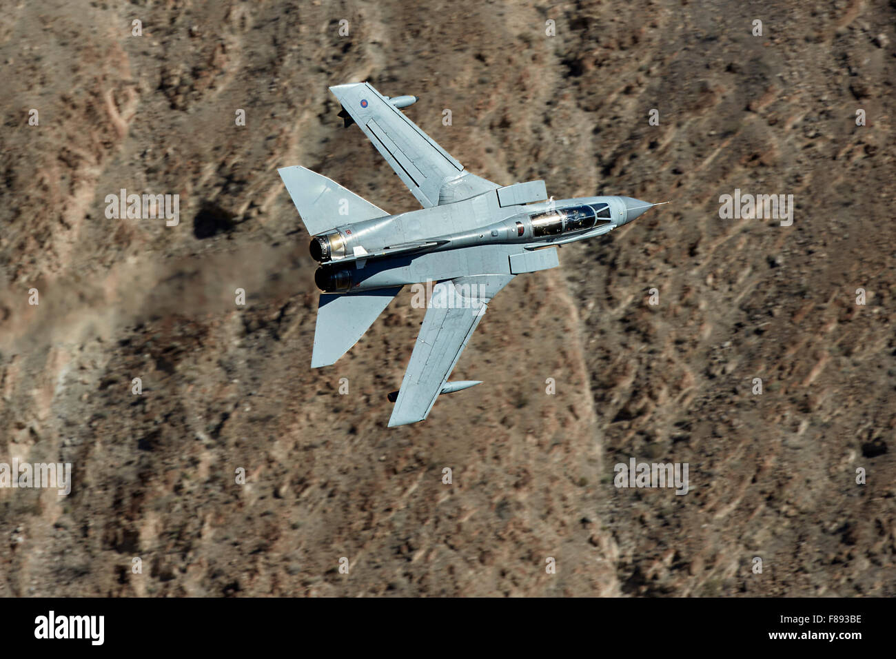 Royal Air Force Tornado GR4 Jet Fighter Flying At Banking Through Rainbow Canyon, California. Stock Photo