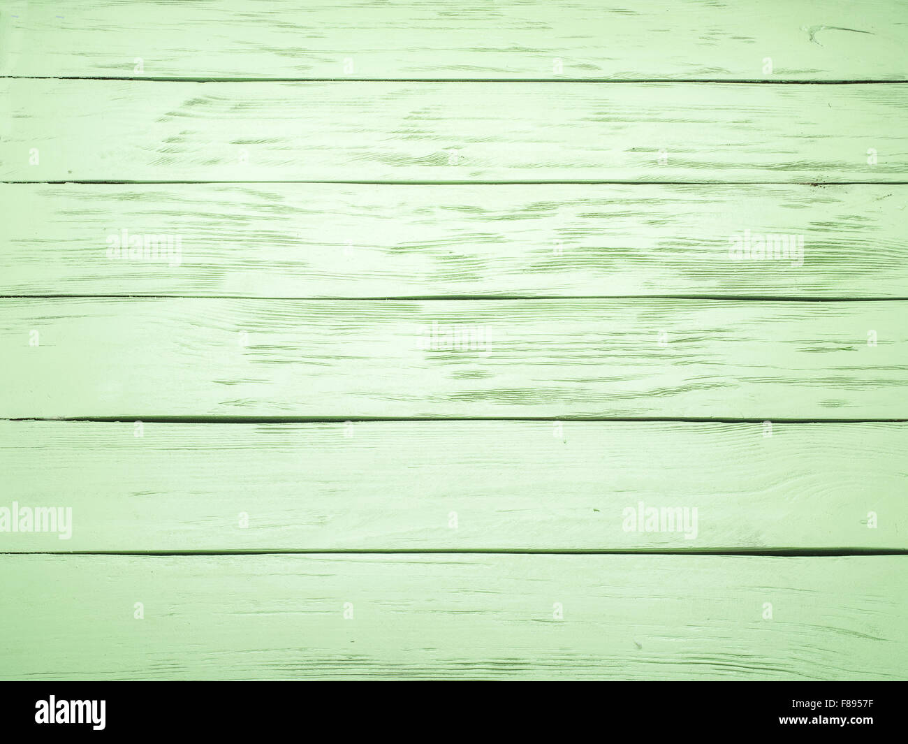 Wooden background painted in light green color. Stock Photo