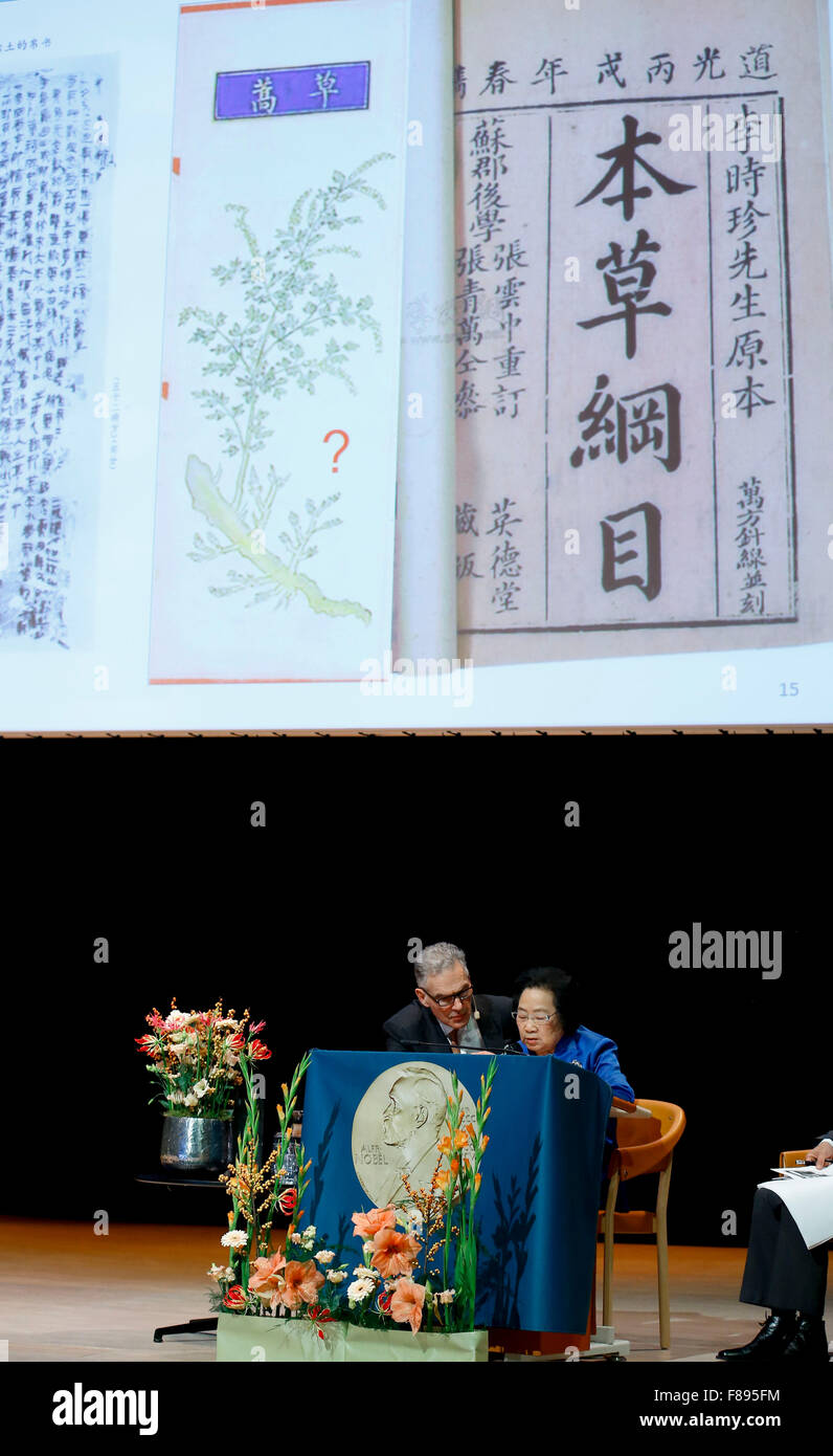 Stockholm, Sweden. 7th Dec, 2015. China's Tu Youyou (R) who won 2015 Nobel Prize in Physiology or Medicine gives a lecture in Karolinska Institutet, Stockholm, capital of Sweden, Dec. 7, 2015. Credit:  Ye Pingfan/Xinhua/Alamy Live News Stock Photo