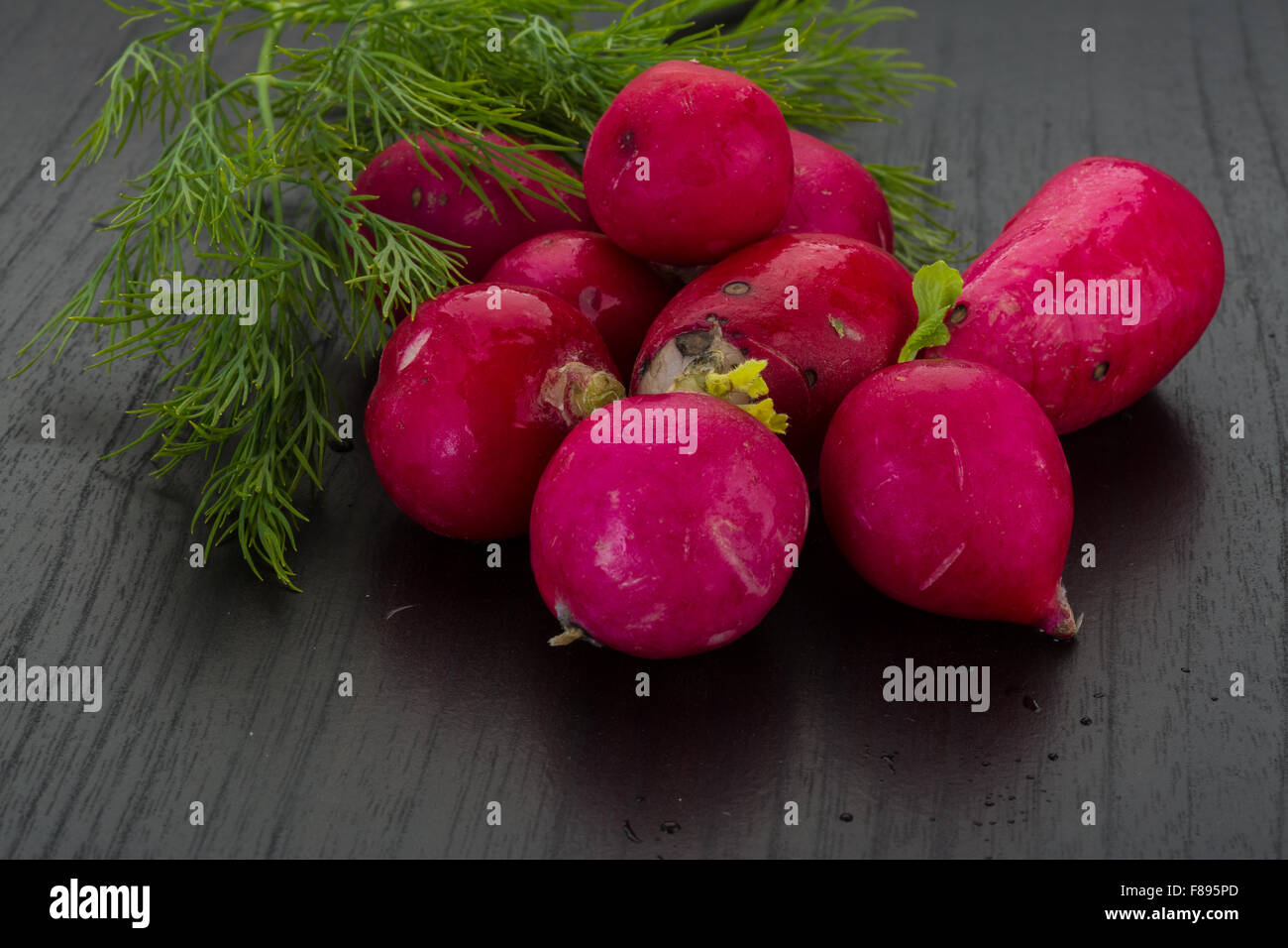Radish with dill on the desk Stock Photo - Alamy